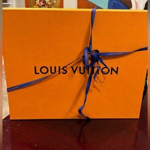 1 Louis Vuitton box with stuffing and 1 Louis Vuitton bag